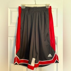 Red, Black, and White Adidas men’s basketball shorts.